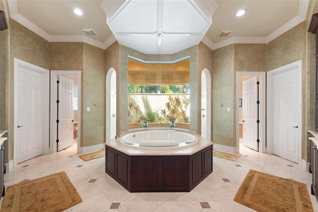 bathroom with ornamental molding, recessed lighting, a bath, and baseboards