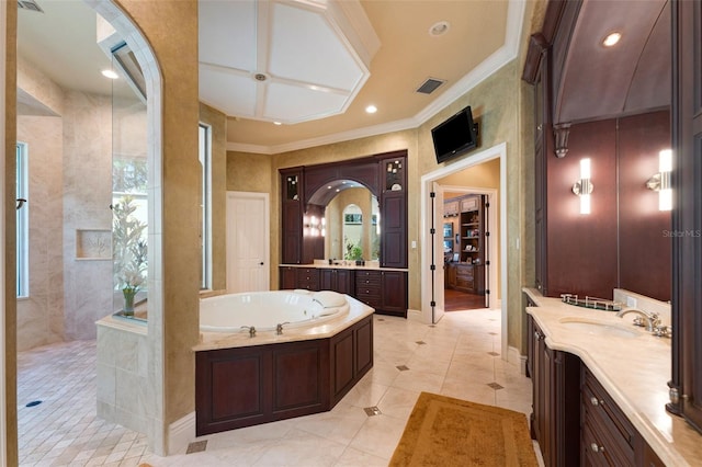 bathroom featuring tile patterned flooring, crown molding, independent shower and bath, and vanity