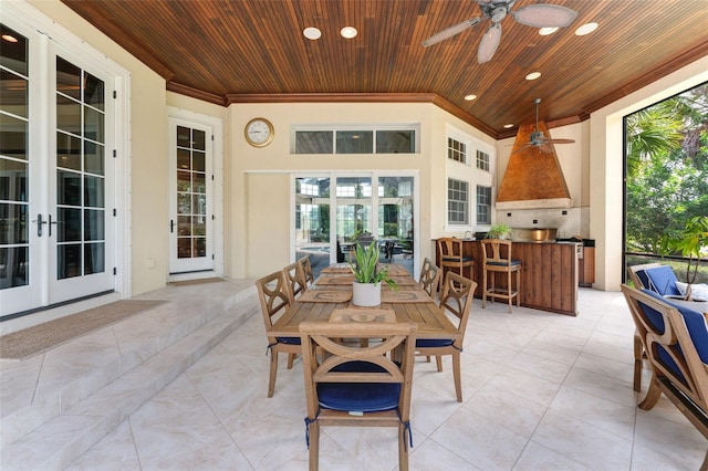 view of patio / terrace featuring exterior bar, french doors, an outdoor kitchen, an outdoor hangout area, and ceiling fan