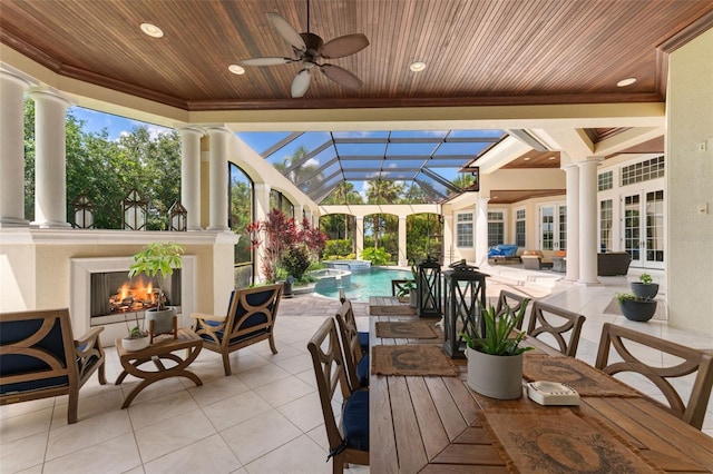 view of patio / terrace with ceiling fan and an outdoor living space