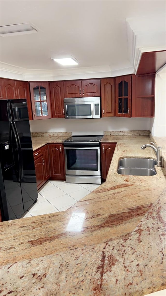 kitchen with stainless steel appliances, crown molding, light tile patterned floors, and sink