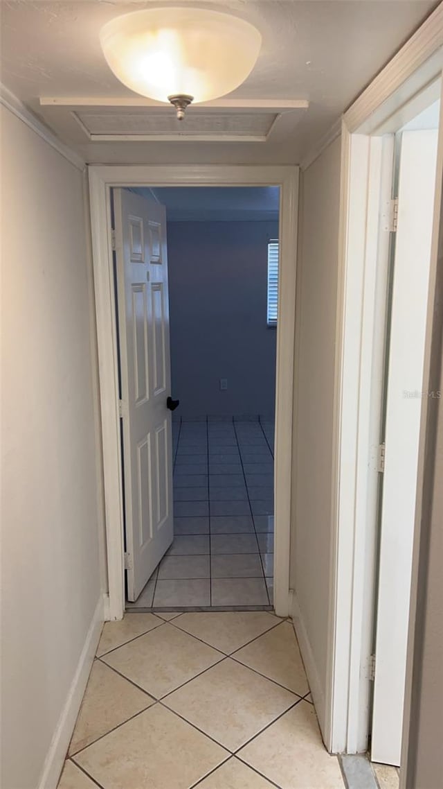 corridor with light tile patterned floors