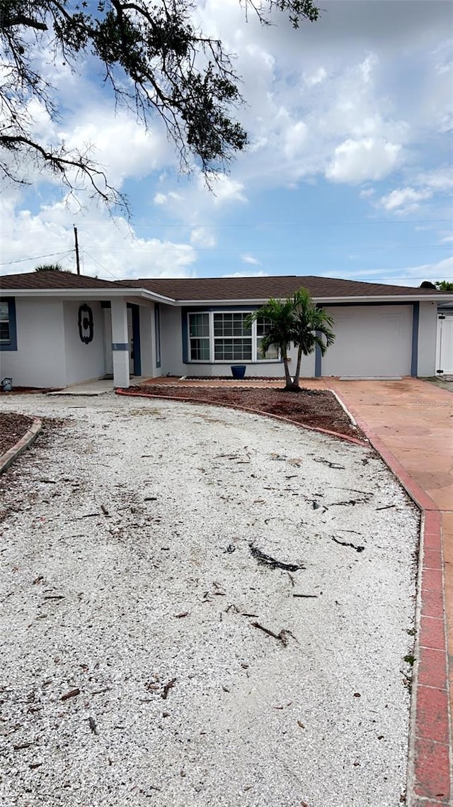 ranch-style house featuring a garage