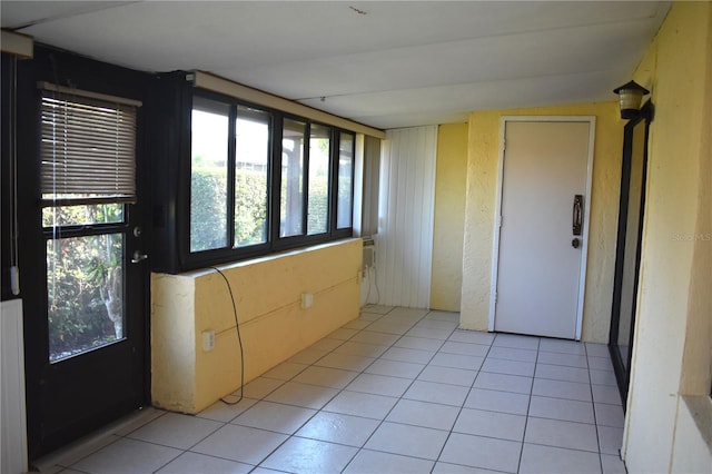 empty room featuring light tile patterned floors