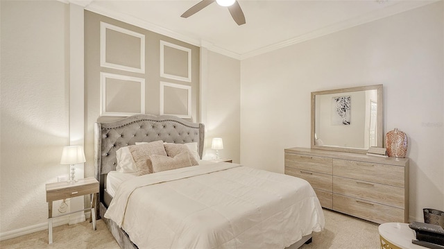 carpeted bedroom featuring ceiling fan and ornamental molding