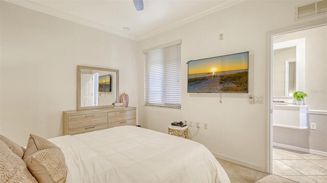 bedroom featuring ceiling fan, light tile patterned floors, and ornamental molding