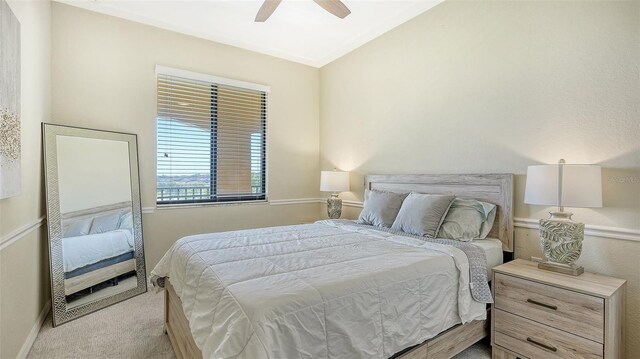 carpeted bedroom featuring ceiling fan and lofted ceiling