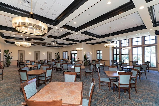 dining room with coffered ceiling, plenty of natural light, dark colored carpet, and a high ceiling