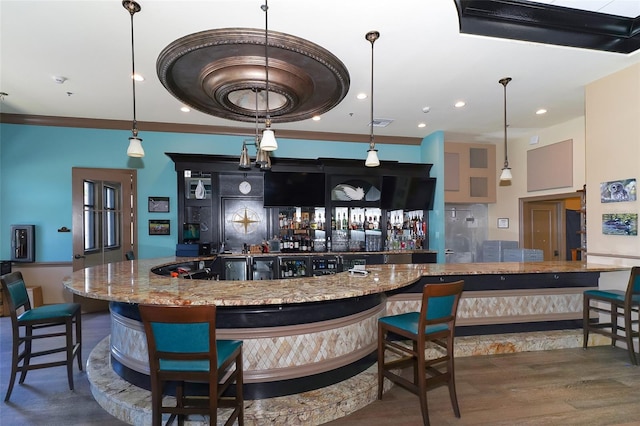 interior space featuring stone counters and hardwood / wood-style floors