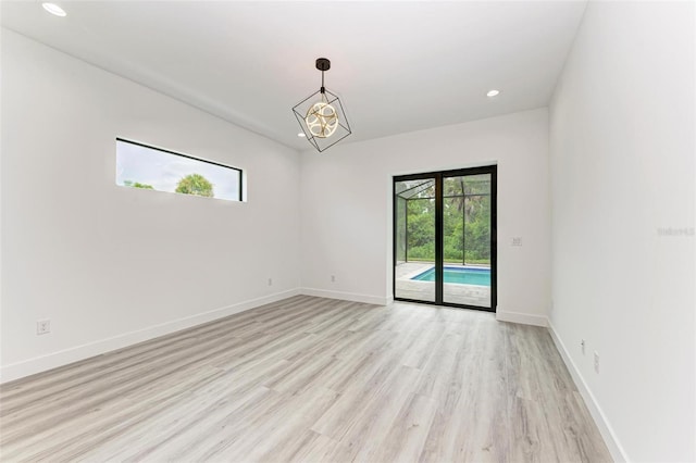 unfurnished room with light hardwood / wood-style flooring