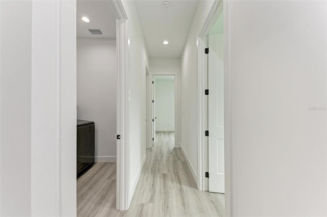 hall featuring light hardwood / wood-style floors