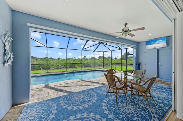 view of pool with ceiling fan