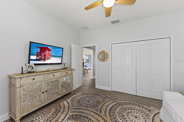 bedroom featuring hardwood / wood-style floors, a closet, and ceiling fan