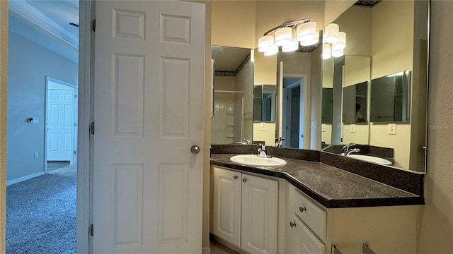 bathroom with vanity and crown molding