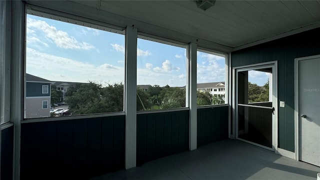 unfurnished sunroom with a wealth of natural light