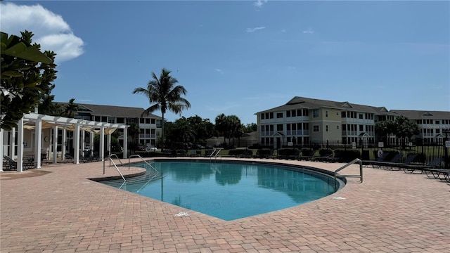 view of swimming pool with a pergola