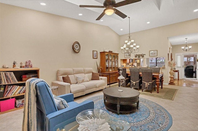 living room featuring light tile patterned floors, ceiling fan with notable chandelier, and high vaulted ceiling