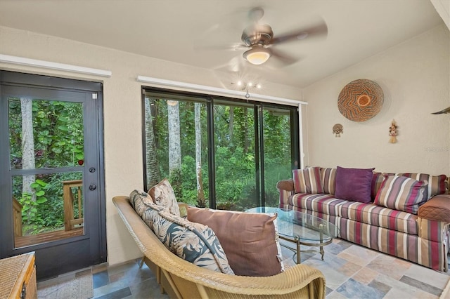 living room with lofted ceiling and ceiling fan