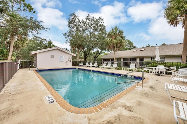 view of swimming pool with a patio area