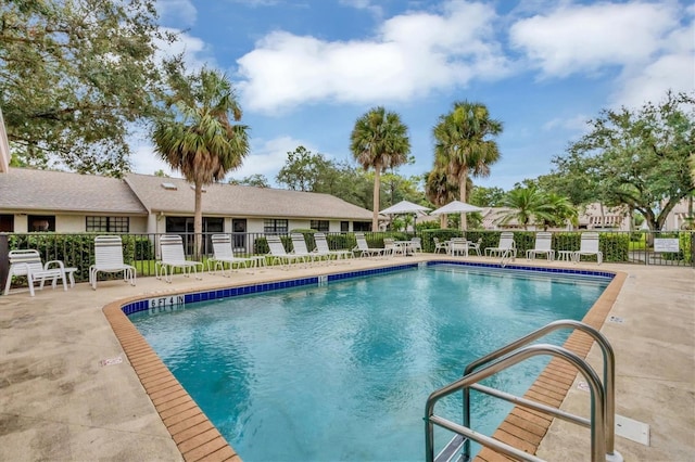 view of swimming pool featuring a patio area