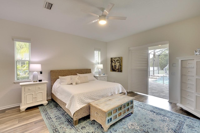 bedroom featuring ceiling fan, wood-type flooring, and access to outside