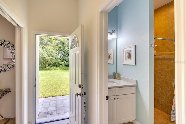 doorway to outside featuring light tile patterned floors