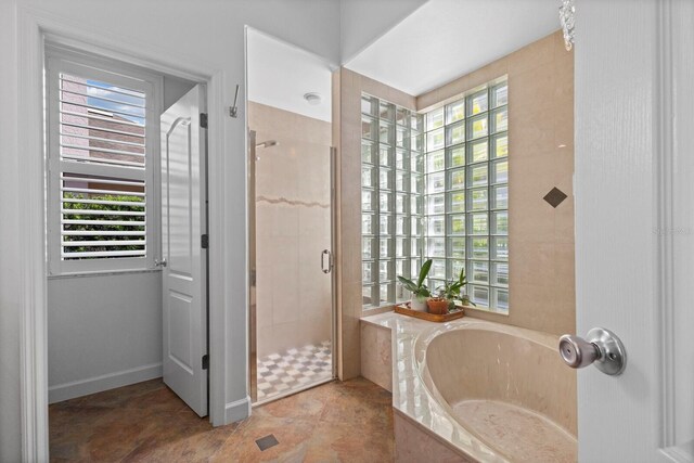 bathroom featuring plus walk in shower