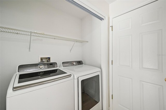 clothes washing area featuring independent washer and dryer