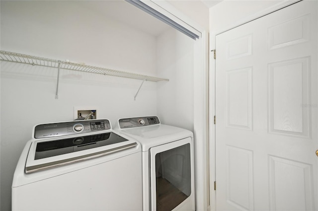 washroom with washer and dryer and laundry area