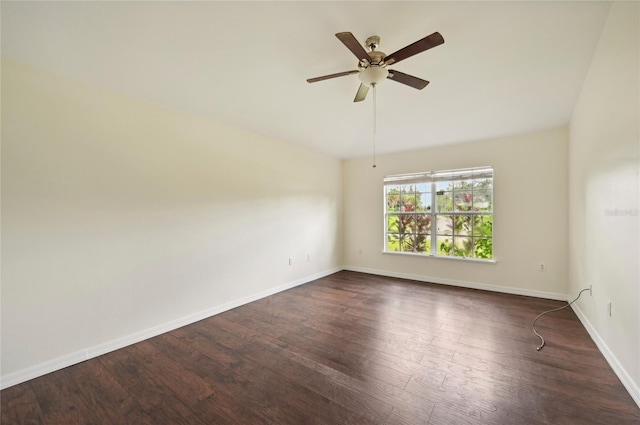 empty room with ceiling fan, hardwood / wood-style flooring, and vaulted ceiling