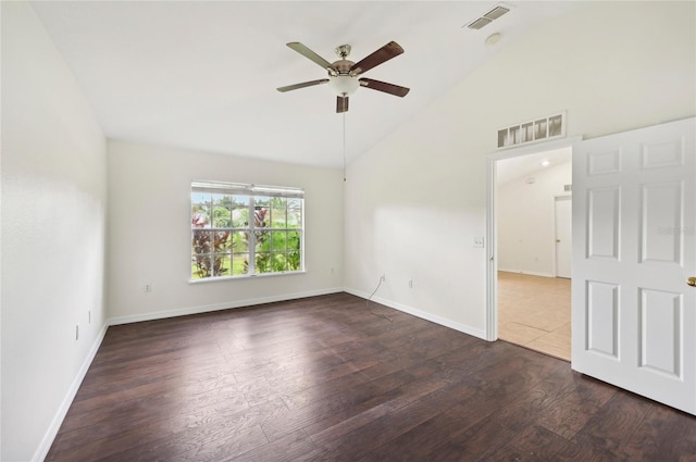 tiled empty room with ceiling fan and high vaulted ceiling