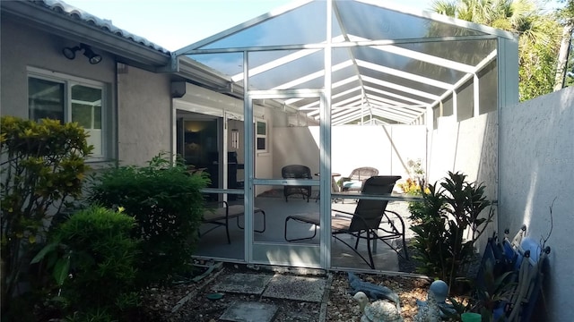 view of patio with a lanai