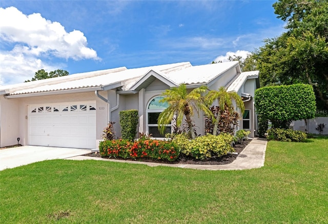 view of front of house featuring a garage and a front yard