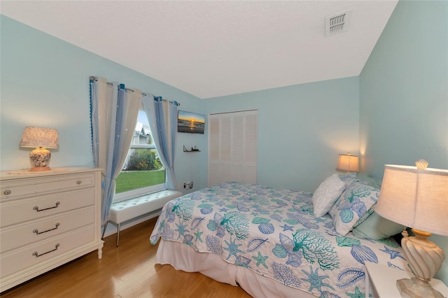 bedroom with light wood-type flooring