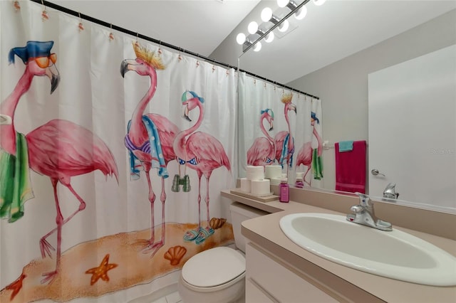 bathroom featuring a shower with curtain, vanity, and toilet