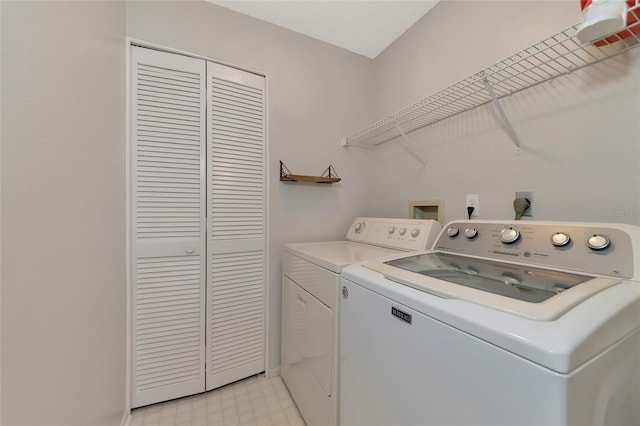 washroom with separate washer and dryer