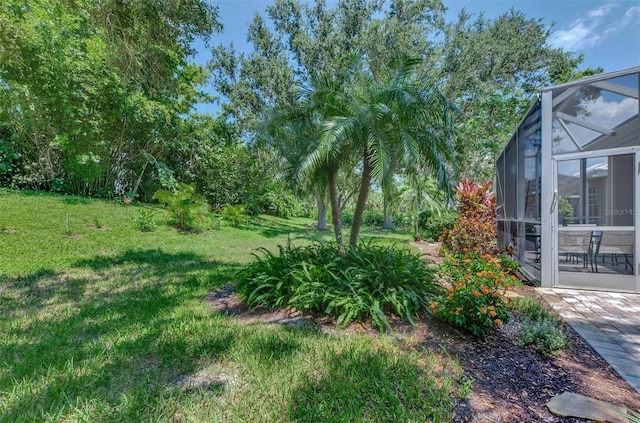 view of yard featuring a lanai