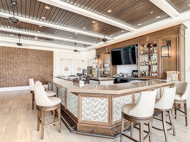 bar with pendant lighting, ceiling fan, light hardwood / wood-style flooring, and wooden ceiling