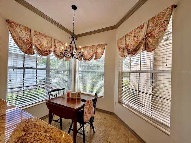 dining room with plenty of natural light, a chandelier, and ornamental molding