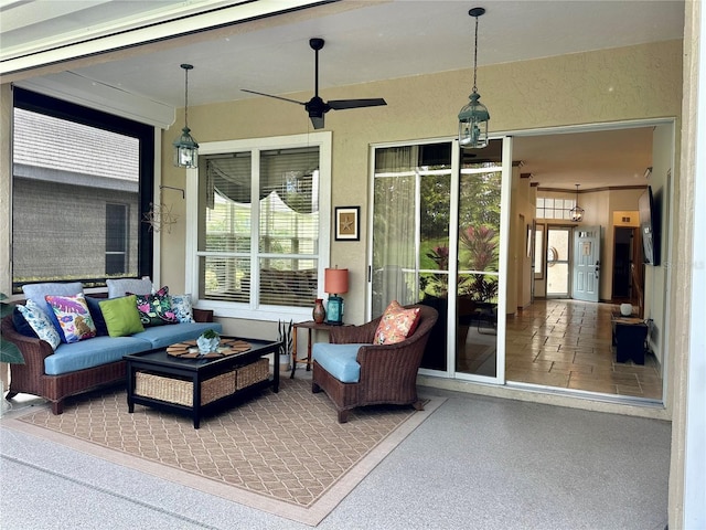 sunroom with ceiling fan