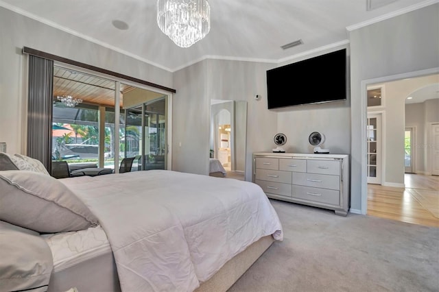 carpeted bedroom featuring multiple windows, a notable chandelier, access to outside, and crown molding