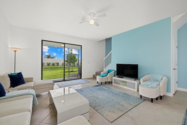 tiled living room featuring ceiling fan