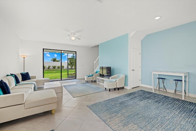 tiled living room featuring ceiling fan