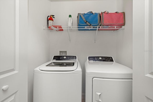 washroom featuring washer and dryer