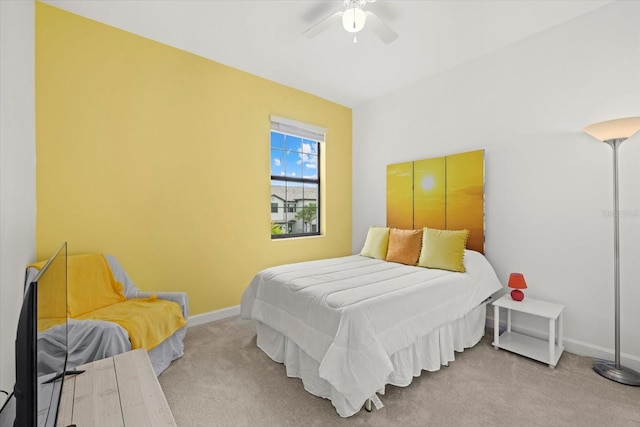 bedroom featuring light carpet and ceiling fan