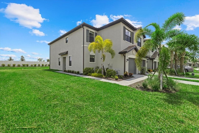 exterior space with a garage and a front lawn