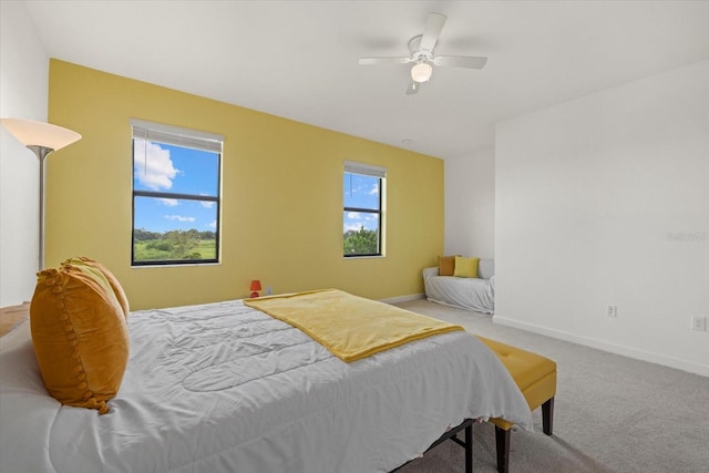 bedroom with ceiling fan and carpet floors