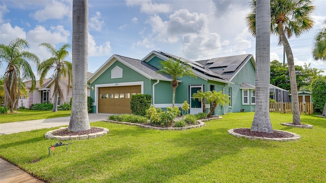 view of front of home with a front lawn, solar panels, and a garage