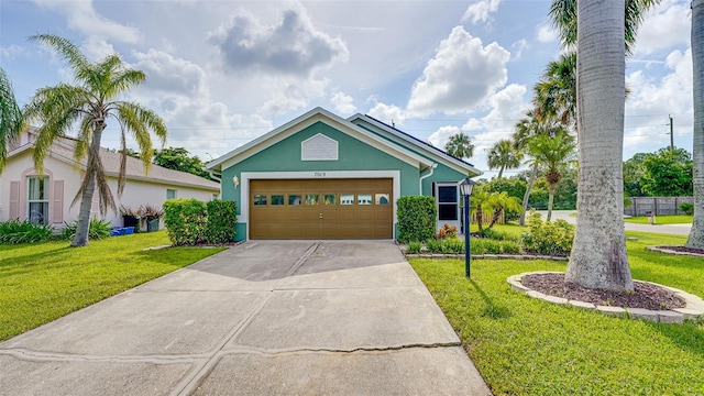 view of front of home with a garage and a front yard