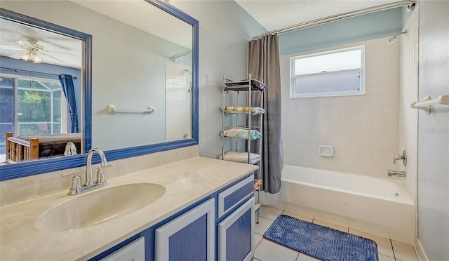 bathroom featuring ceiling fan, tile patterned flooring, vanity, and shower / bathtub combination with curtain